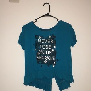 A blue children’s top.